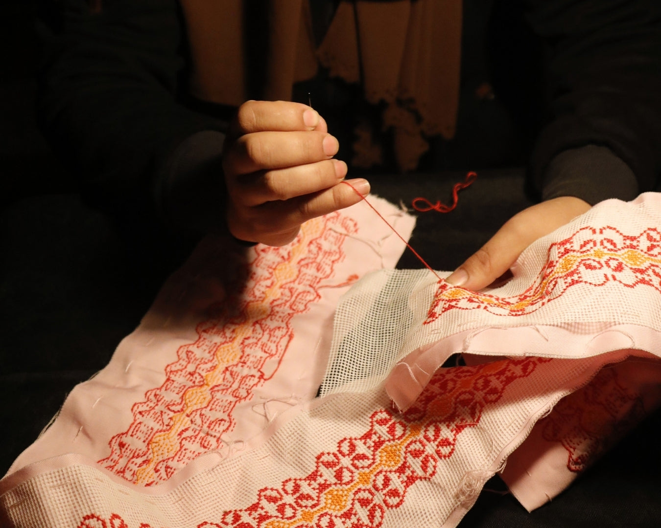 Close-up of hand embroidery by Palestinian artisan in Jerash camp, Jordan, for 1001 Stories