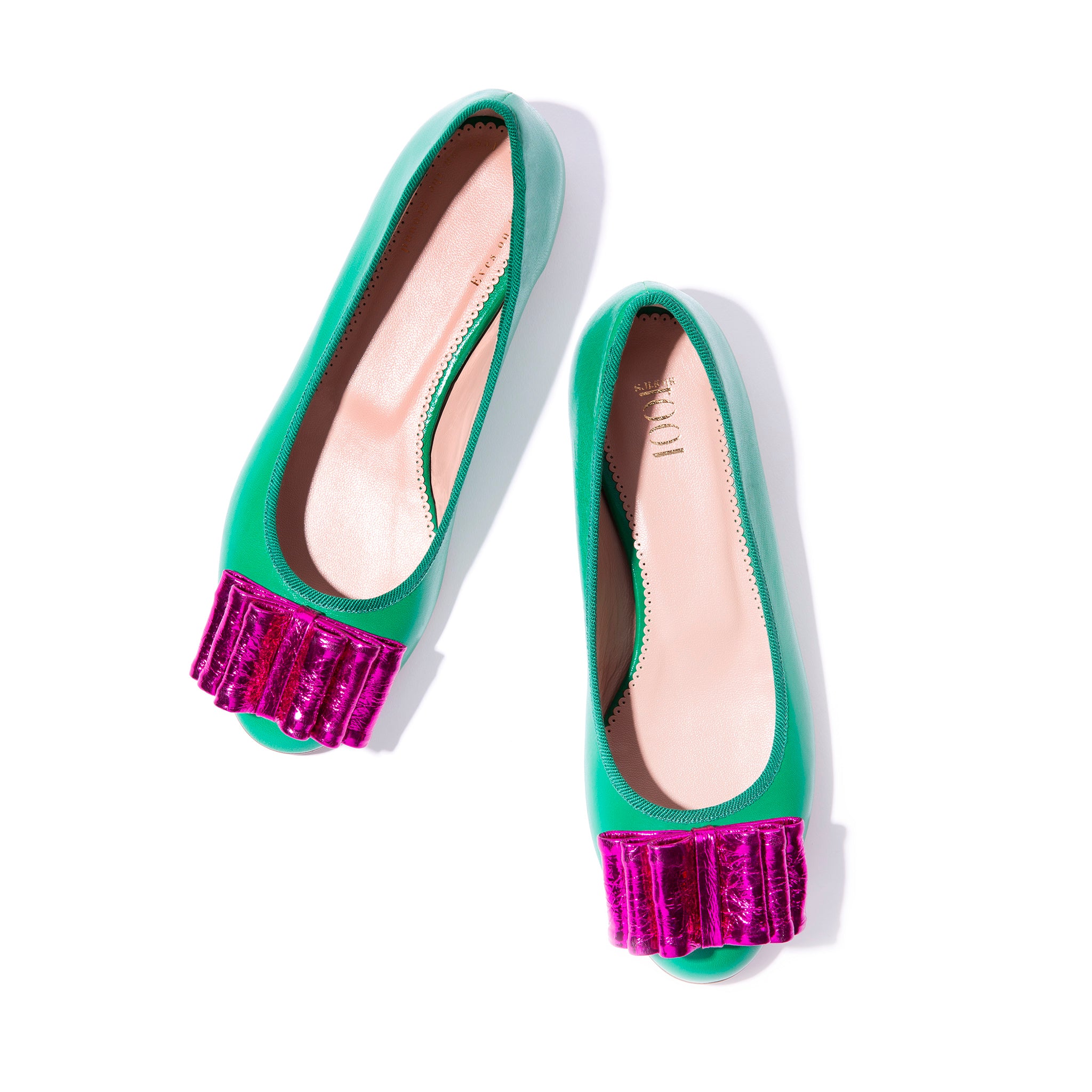 Green leather ballet flats with fuchsia bow