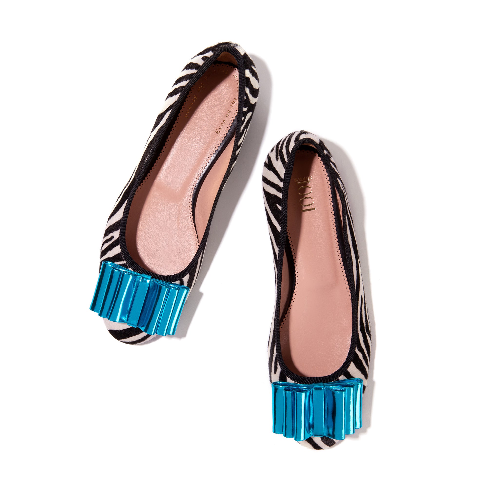 Faux zebra ballet flats with turquoise bow